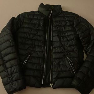 Black jacket with gold zippers